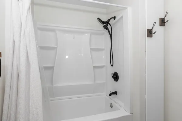 a bathroom with a bath tub