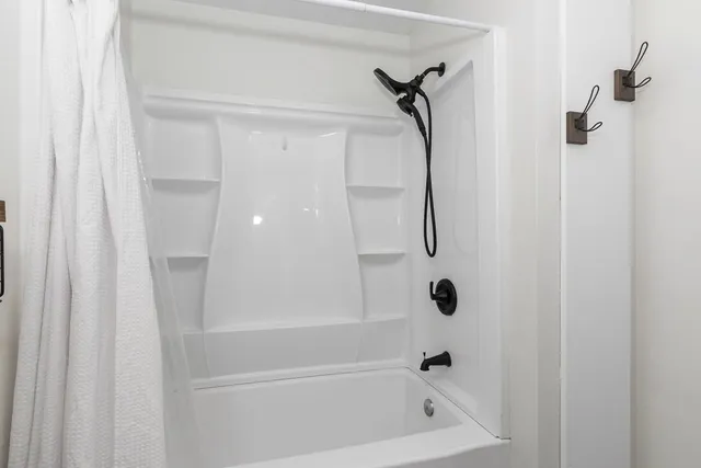 a bathroom with a bath tub