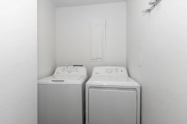 a utility room with dryer and washer