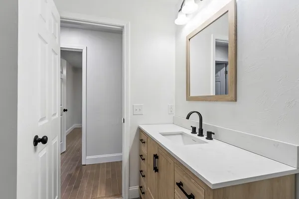 a bathroom with a sink and a mirror