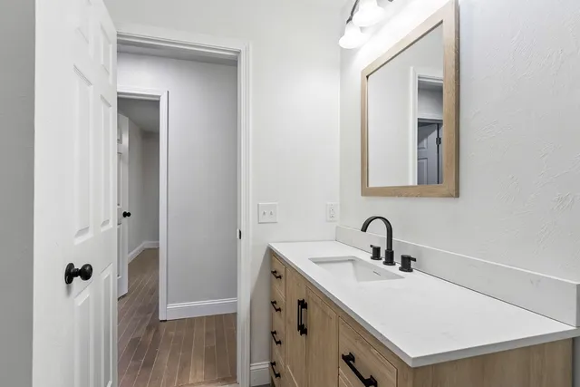 a bathroom with a sink and a mirror