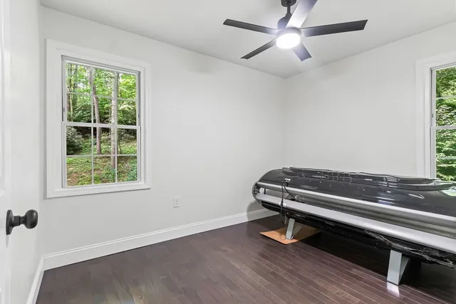 a room with gym equipment and a window