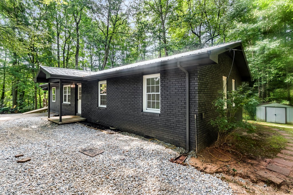 123 Quarry Road Andrews, NC 28901 - Photo 4 of 51 a front view of a house with a garden