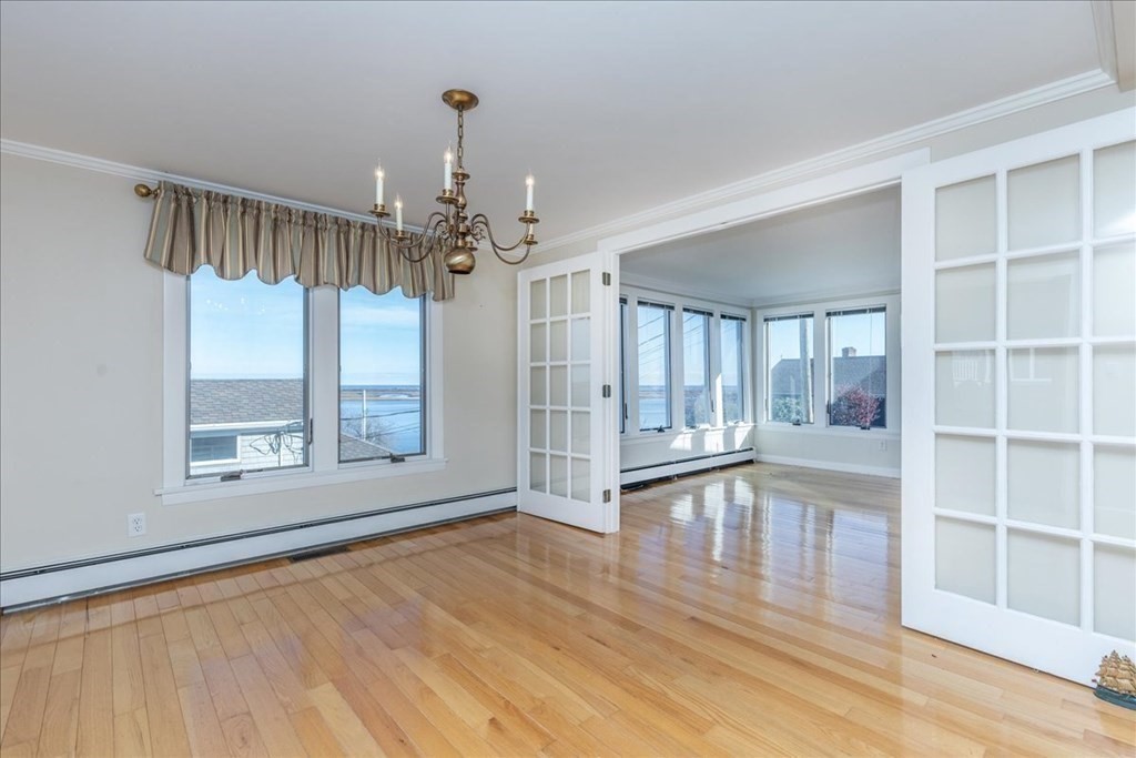 106 North Ridge Road Ipswich, MA 01938 - Photo 16 of 42 a view of an empty room with wooden floor and a window