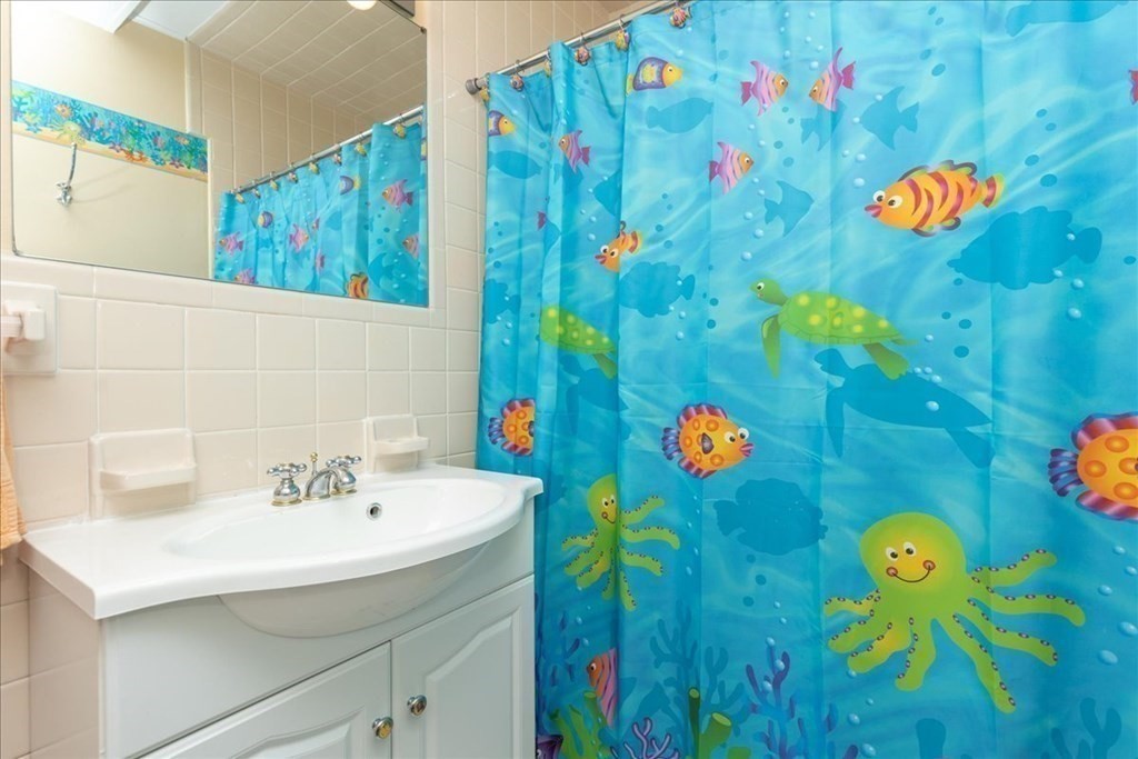 106 North Ridge Road Ipswich, MA 01938 - Photo 22 of 42 a bathroom with a sink and mirror