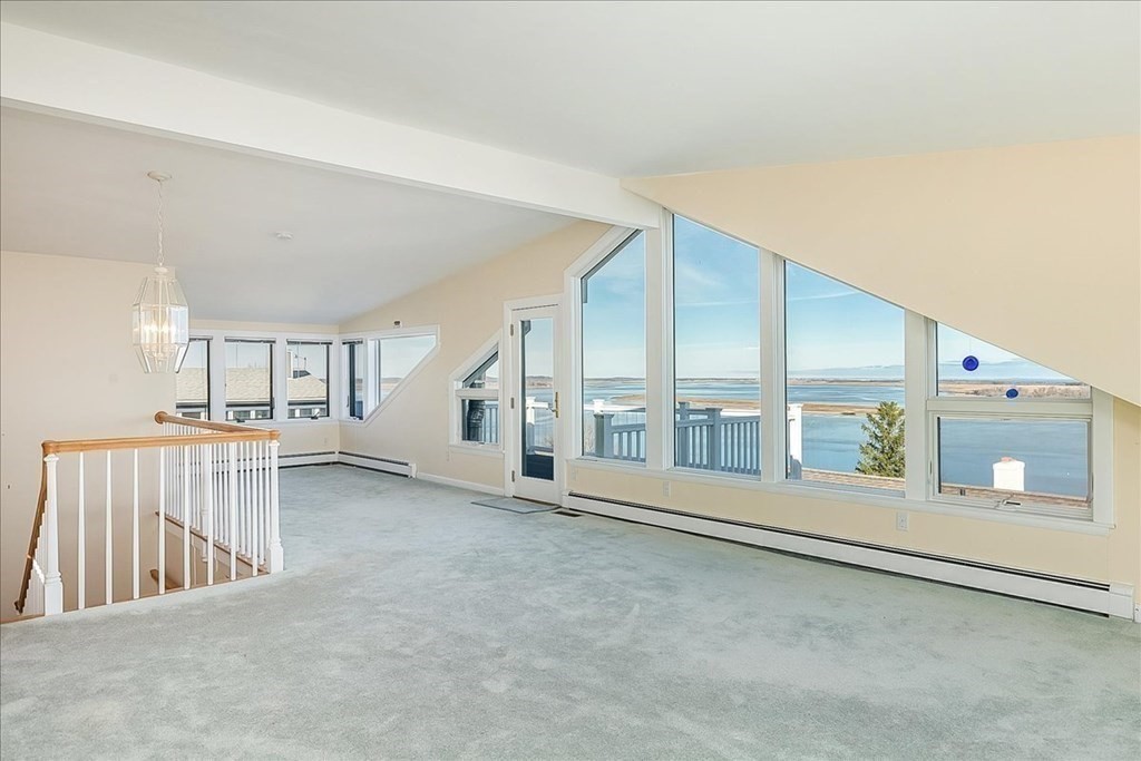106 North Ridge Road Ipswich, MA 01938 - Photo 24 of 42 wooden floor in an empty room with a window
