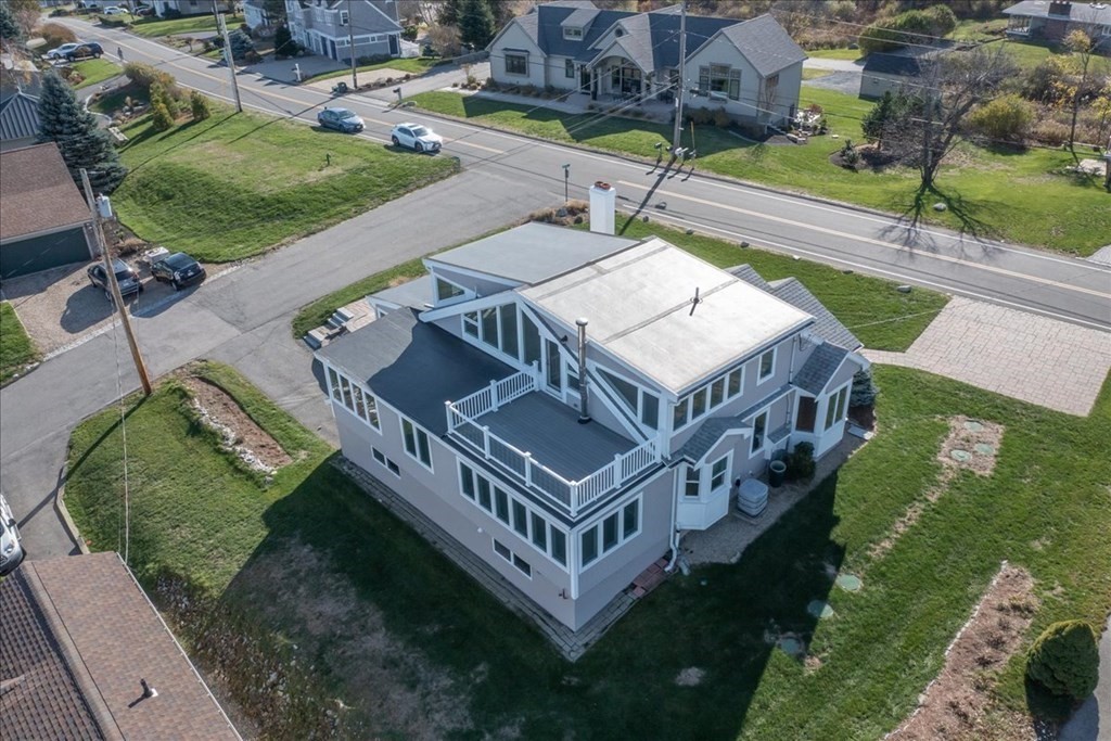 106 North Ridge Road Ipswich, MA 01938 - Photo 41 of 42 an aerial view of a house with a big yard and large trees