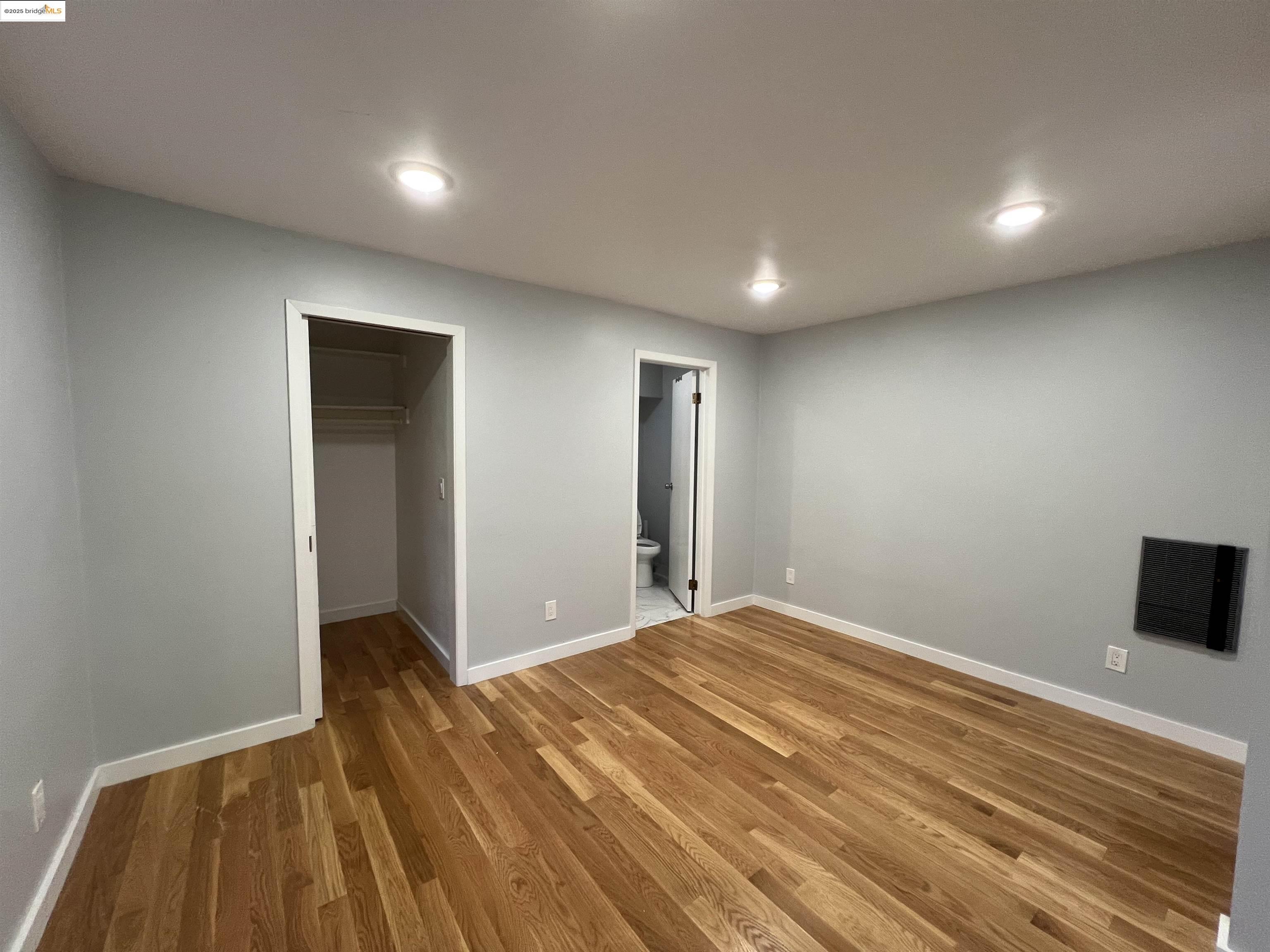 900 Everett Avenue, Unit A Oakland, CA 94602 - Photo 3 of 10 a view of room with wooden floor