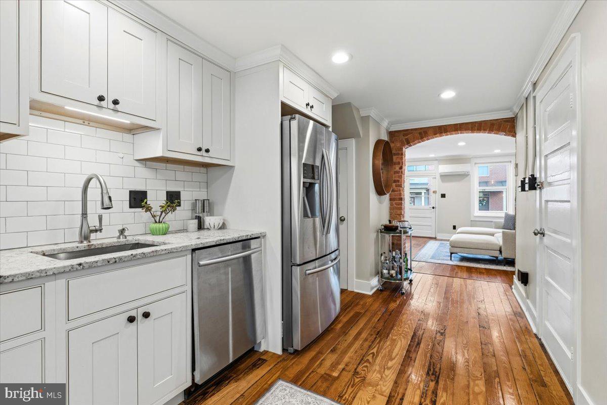37 East 5th Street Frederick, MD 21701 - Photo 11 of 50 a kitchen with a sink and refrigerator