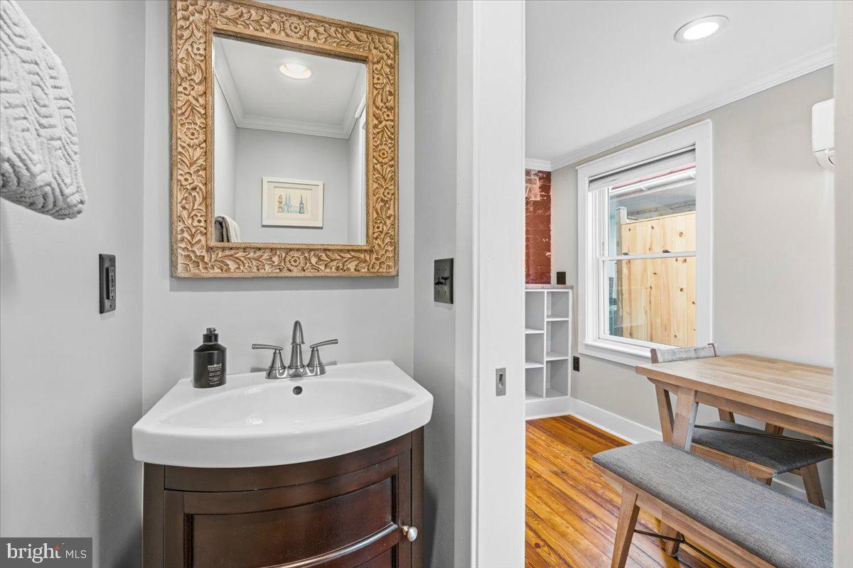 37 East 5th Street Frederick, MD 21701 - Photo 15 of 50 a bathroom with a sink and a mirror