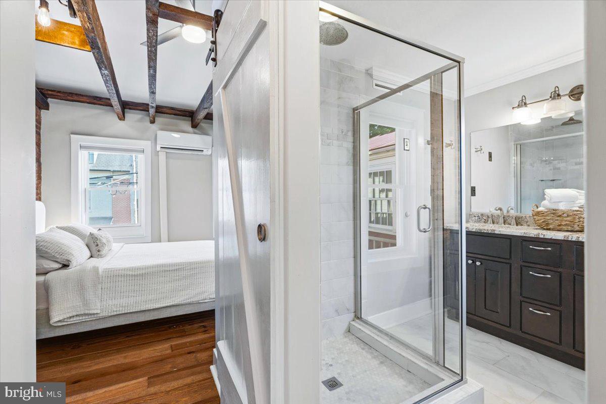 37 East 5th Street Frederick, MD 21701 - Photo 26 of 50 a bathroom with a tub shower vanity and a sink