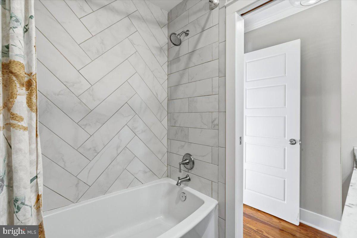 37 East 5th Street Frederick, MD 21701 - Photo 37 of 50 a bathroom with a bathtub and shower