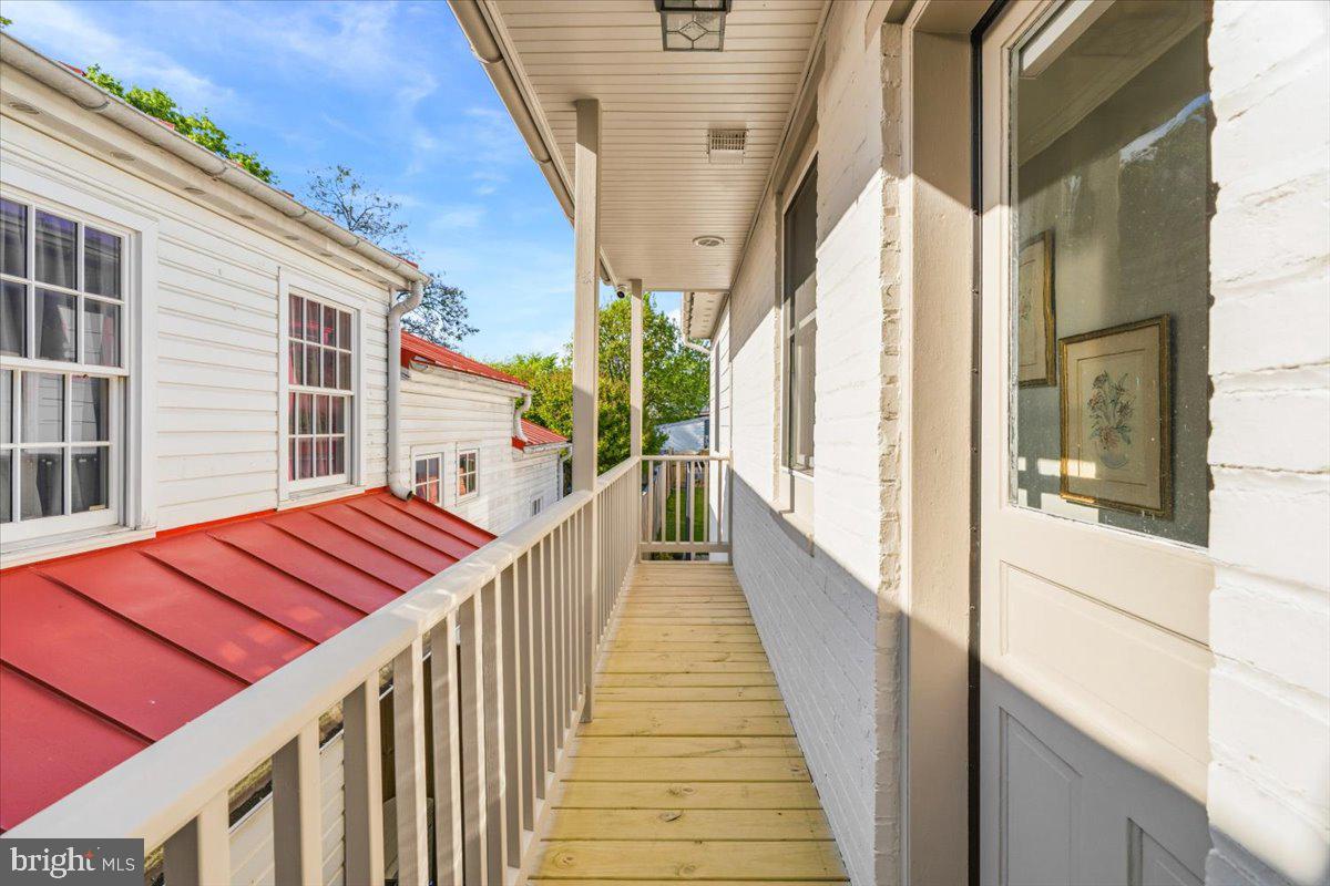 37 East 5th Street Frederick, MD 21701 - Photo 39 of 50 a view of a balcony with wooden floor and stairs