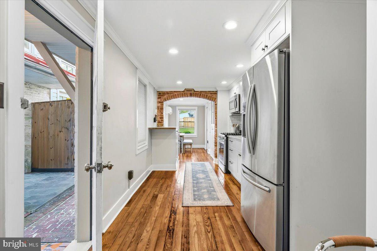 37 East 5th Street Frederick, MD 21701 - Photo 40 of 50 a view of a hallway with wooden floor and staircase