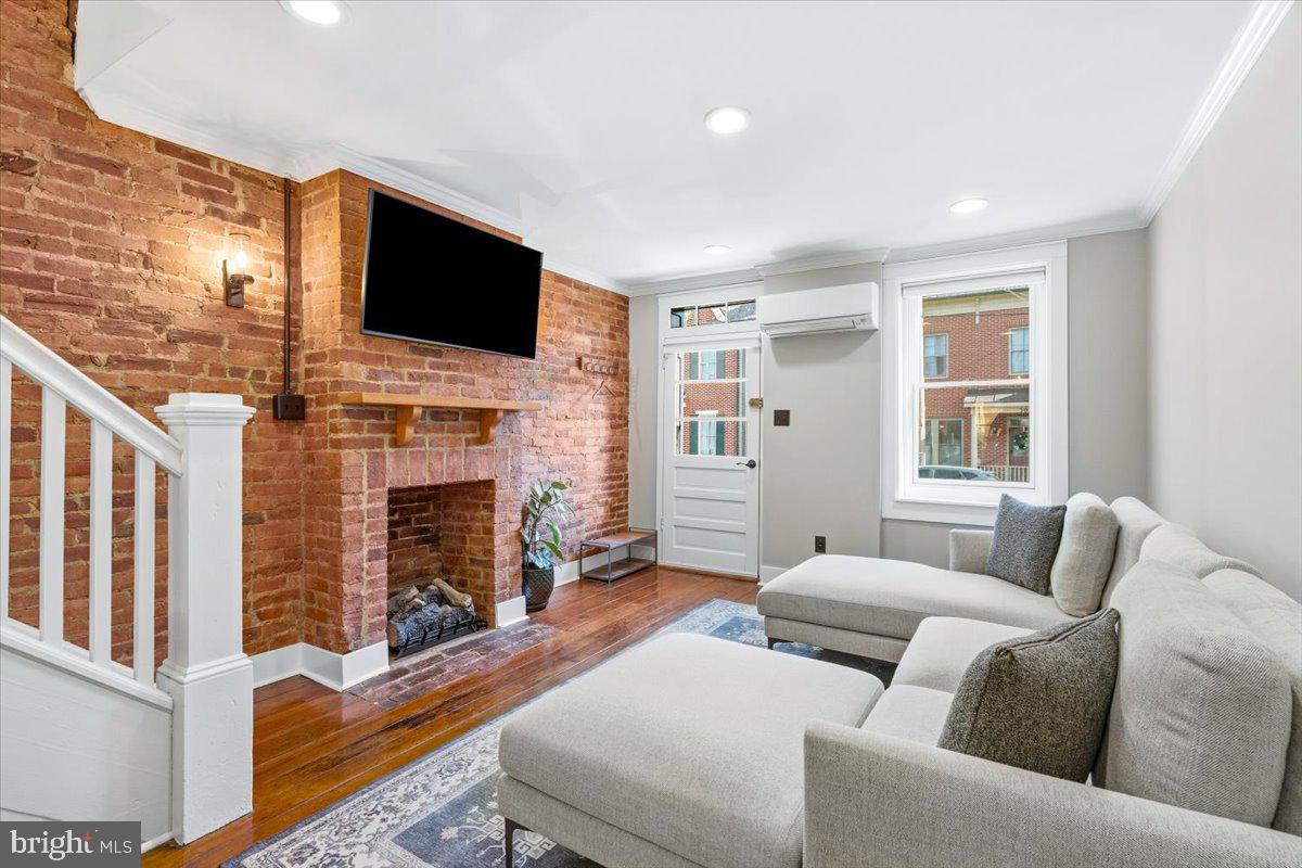 37 East 5th Street Frederick, MD 21701 - Photo 6 of 50 a living room with fireplace furniture and a flat screen tv