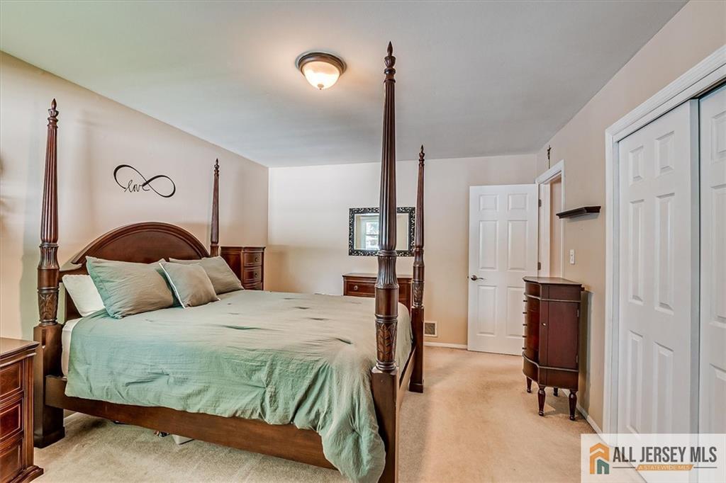 20 Melville Road Edison, NJ 08817 - Photo 14 of 31 a bedroom with a bed dresser and a window