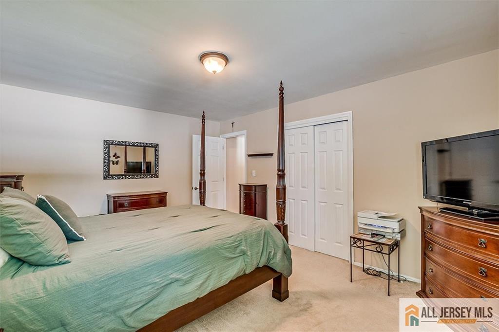 20 Melville Road Edison, NJ 08817 - Photo 15 of 31 a bedroom with a bed and a television