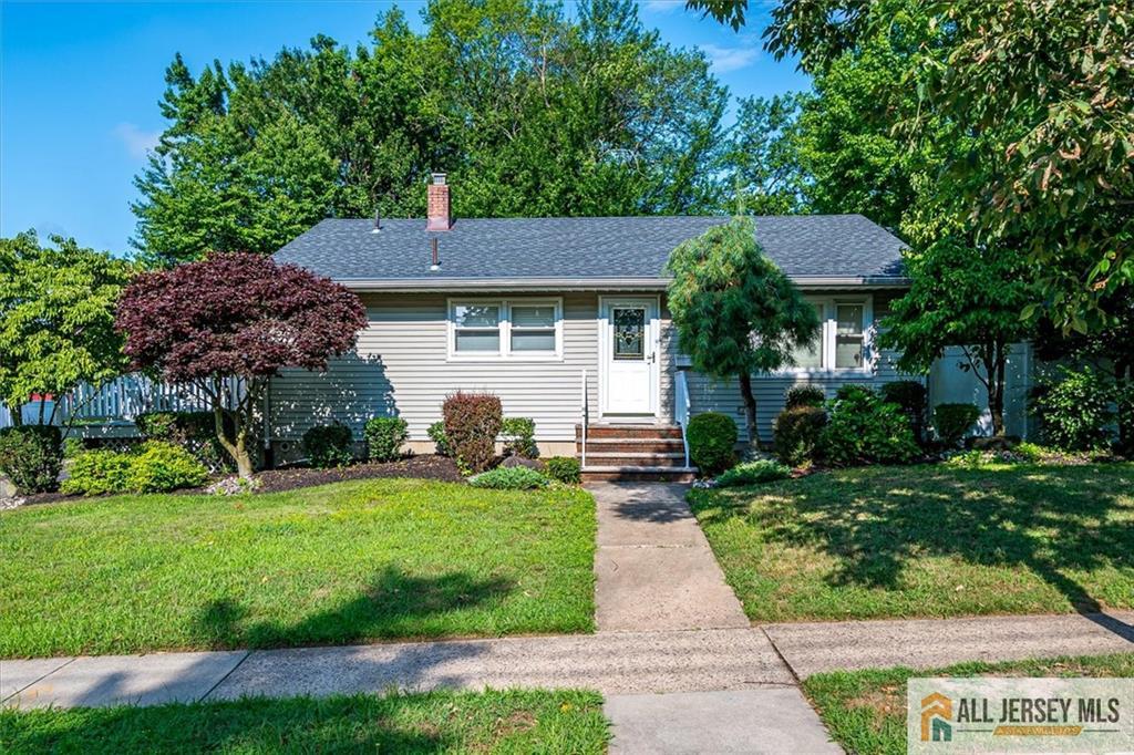 20 Melville Road Edison, NJ 08817 - Photo 2 of 31 a front view of a house with a yard