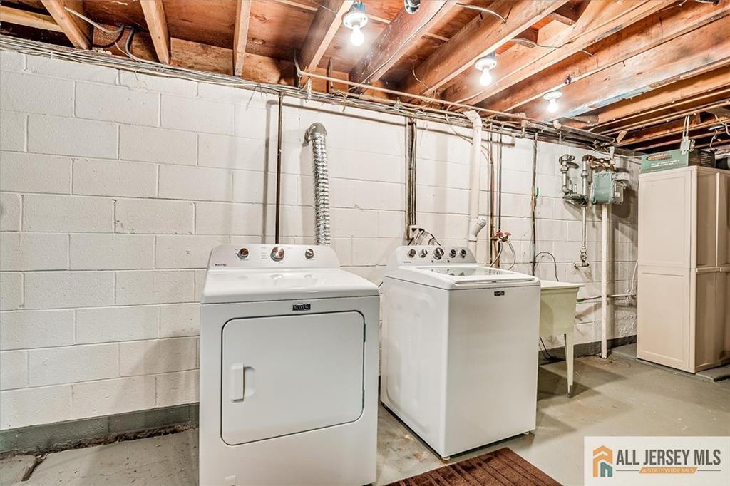 20 Melville Road Edison, NJ 08817 - Photo 24 of 31 a utility room with dryer and washer