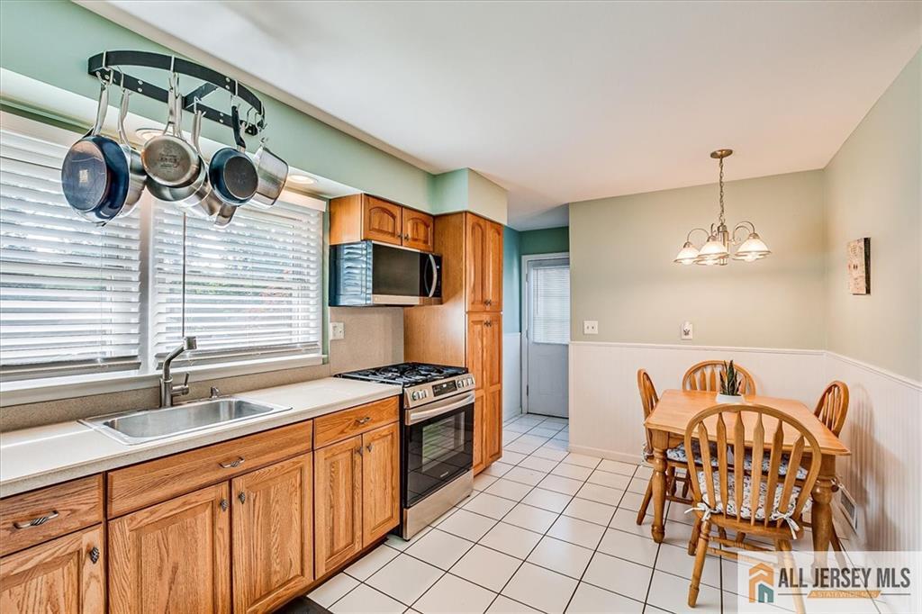20 Melville Road Edison, NJ 08817 - Photo 10 of 31 a kitchen with a sink cabinets and appliances