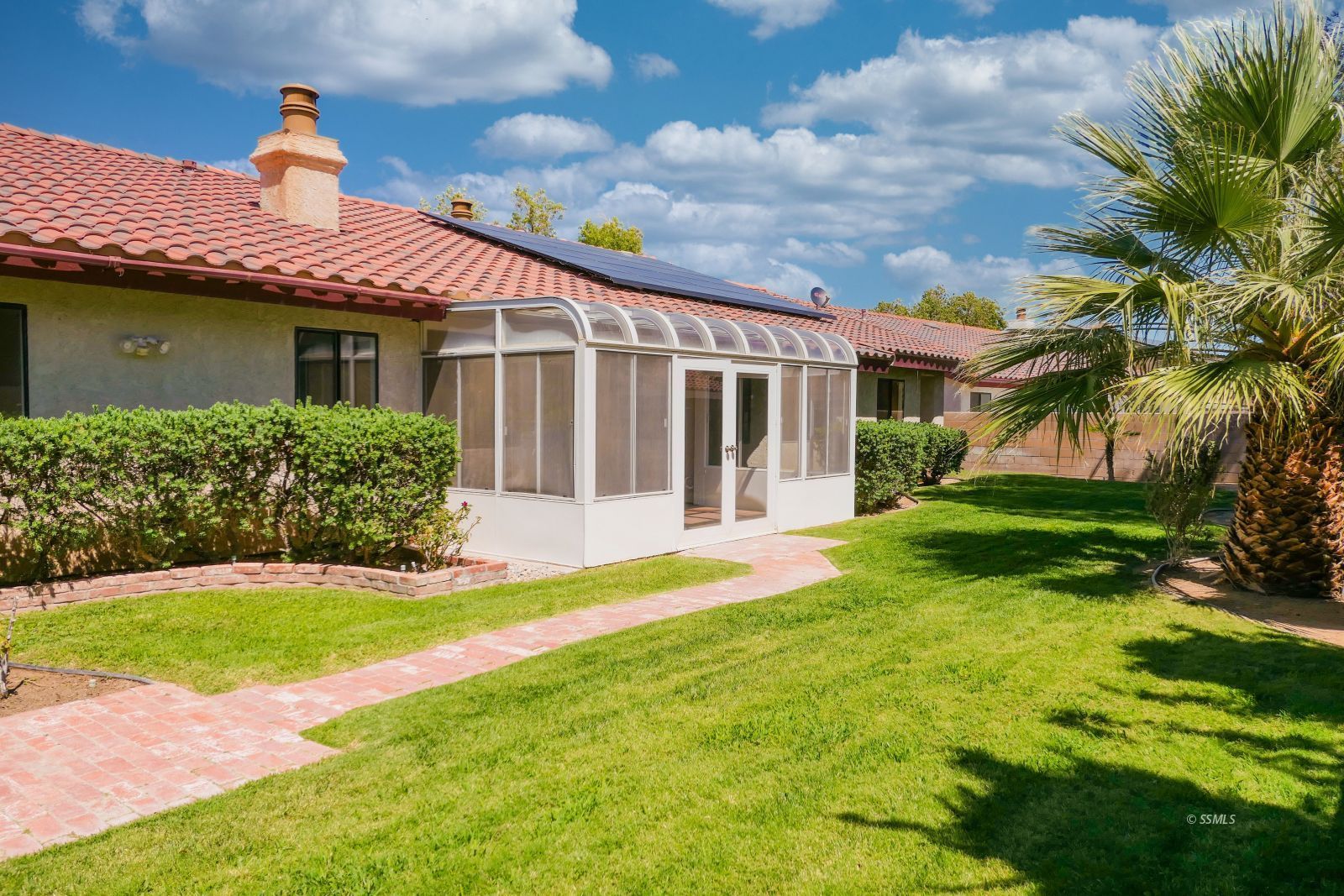 925 Hermosa Avenue Ridgecrest, CA 93555 - Photo 44 of 50 a front view of a house with yard and green space