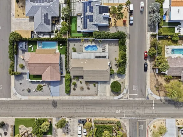 an aerial view of multi story residential apartment building with yard