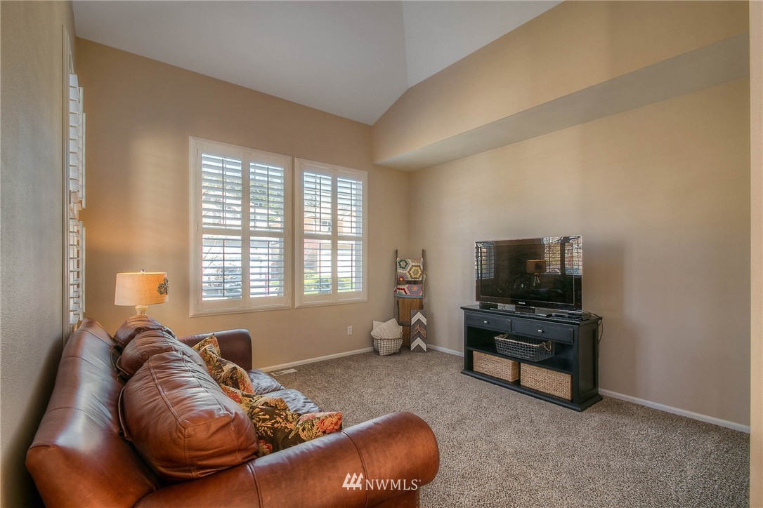 28003 Maple Ridge Way Southeast Maple Valley, WA 98038 - Photo 3 of 22 a living room with furniture and a flat screen tv