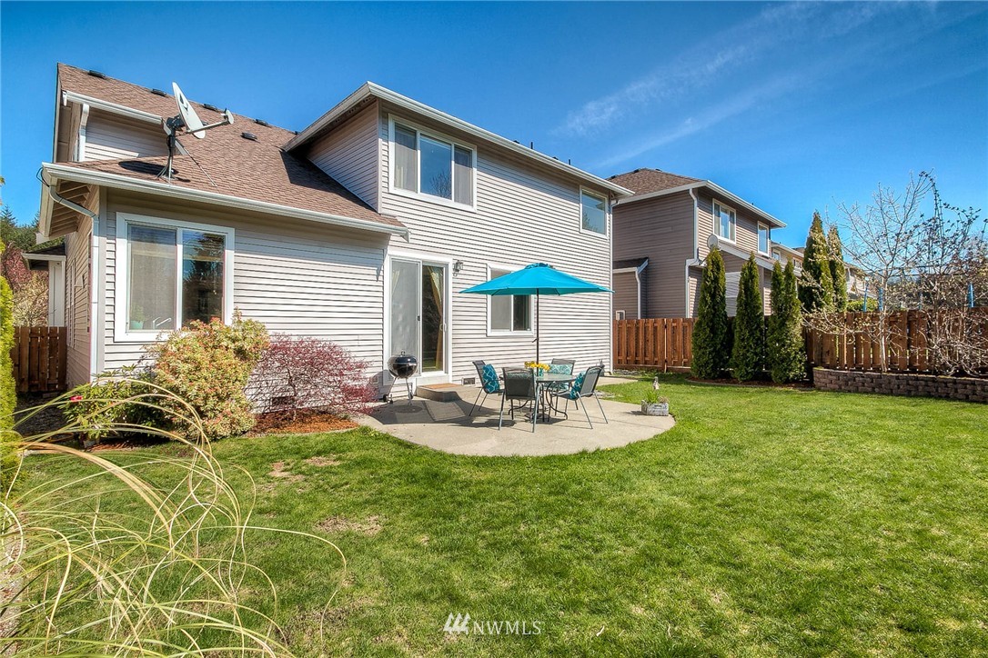 28003 Maple Ridge Way Southeast Maple Valley, WA 98038 - Photo 22 of 22 a view of a house with backyard and sitting area