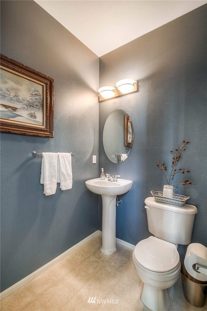 28003 Maple Ridge Way Southeast Maple Valley, WA 98038 - Photo 6 of 22 a bathroom with a toilet sink and mirror