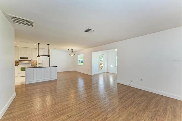 a view of kitchen with wooden floor