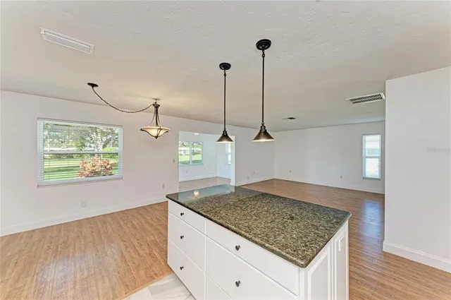 a spacious bedroom with a balcony a large bed and a couch