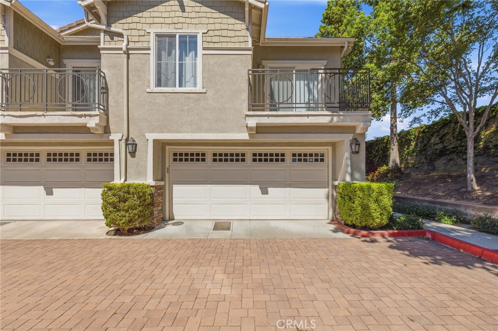 7331 Shelby Place, Unit 84 Rancho Cucamonga, CA 91739 - Photo 1 of 43 a front view of a building with garden