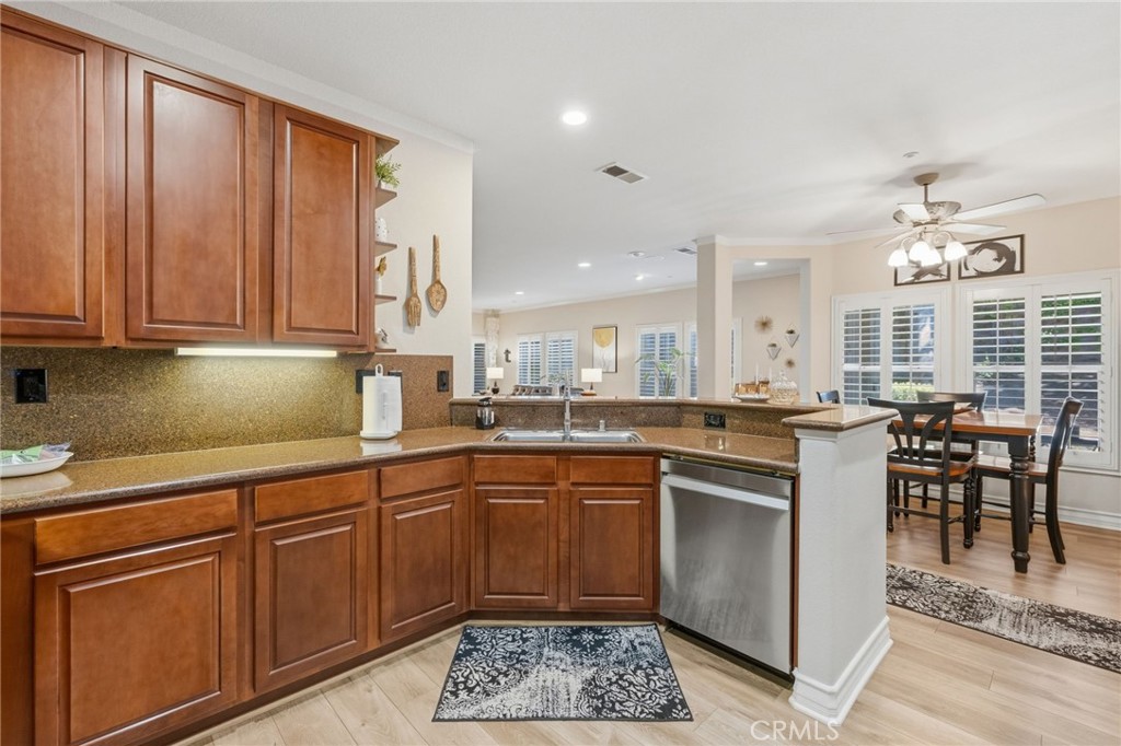 7331 Shelby Place, Unit 84 Rancho Cucamonga, CA 91739 - Photo 13 of 43 a kitchen with lots of counter top space and dining table