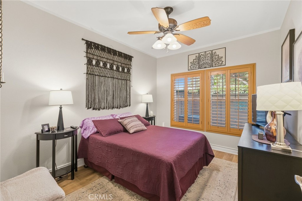7331 Shelby Place, Unit 84 Rancho Cucamonga, CA 91739 - Photo 15 of 43 a bedroom with a bed a lamp and a large window