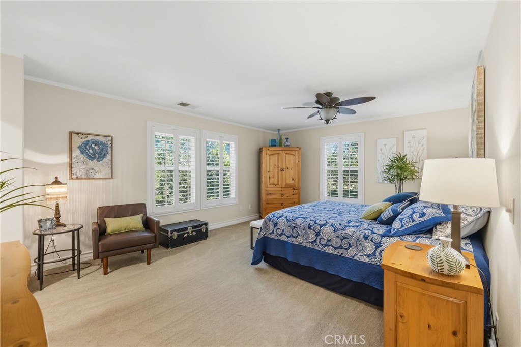 7331 Shelby Place, Unit 84 Rancho Cucamonga, CA 91739 - Photo 21 of 43 a bedroom with a bed and a couch