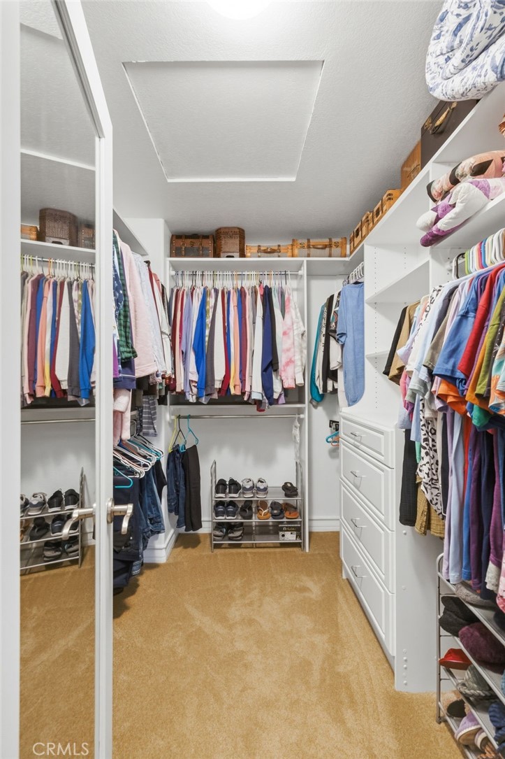7331 Shelby Place, Unit 84 Rancho Cucamonga, CA 91739 - Photo 24 of 43 a view of walk in closet with clothes and shoes