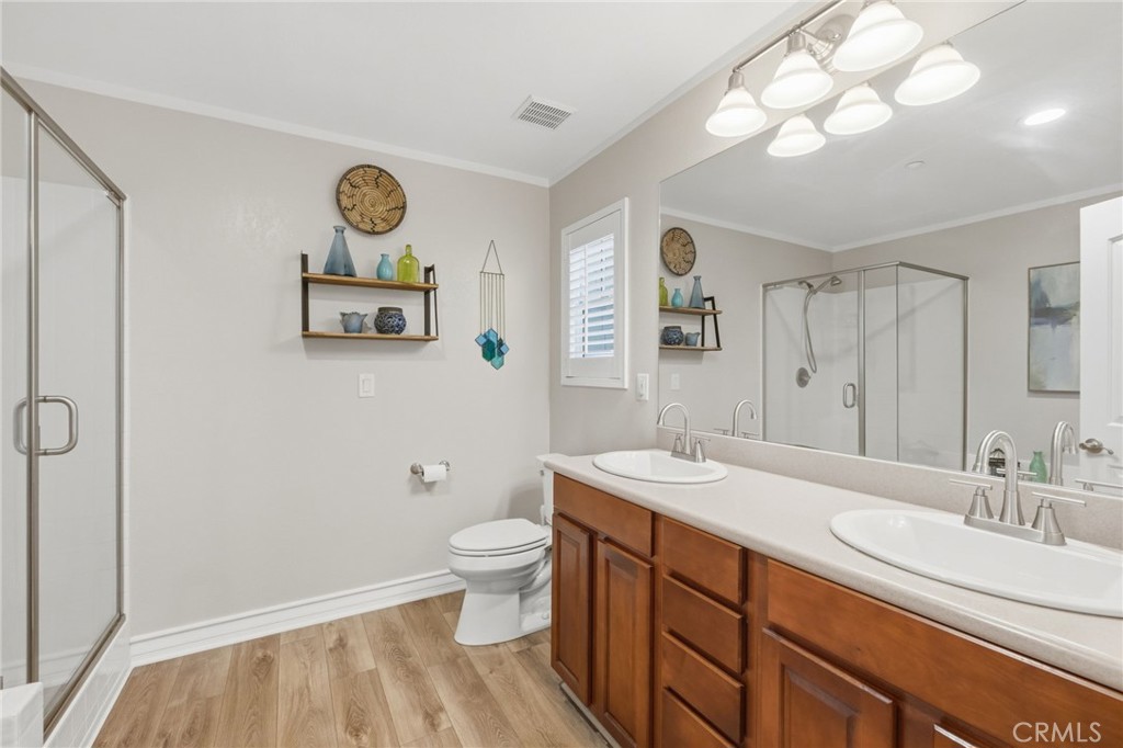 7331 Shelby Place, Unit 84 Rancho Cucamonga, CA 91739 - Photo 25 of 43 a bathroom with a sink a toilet and a mirror