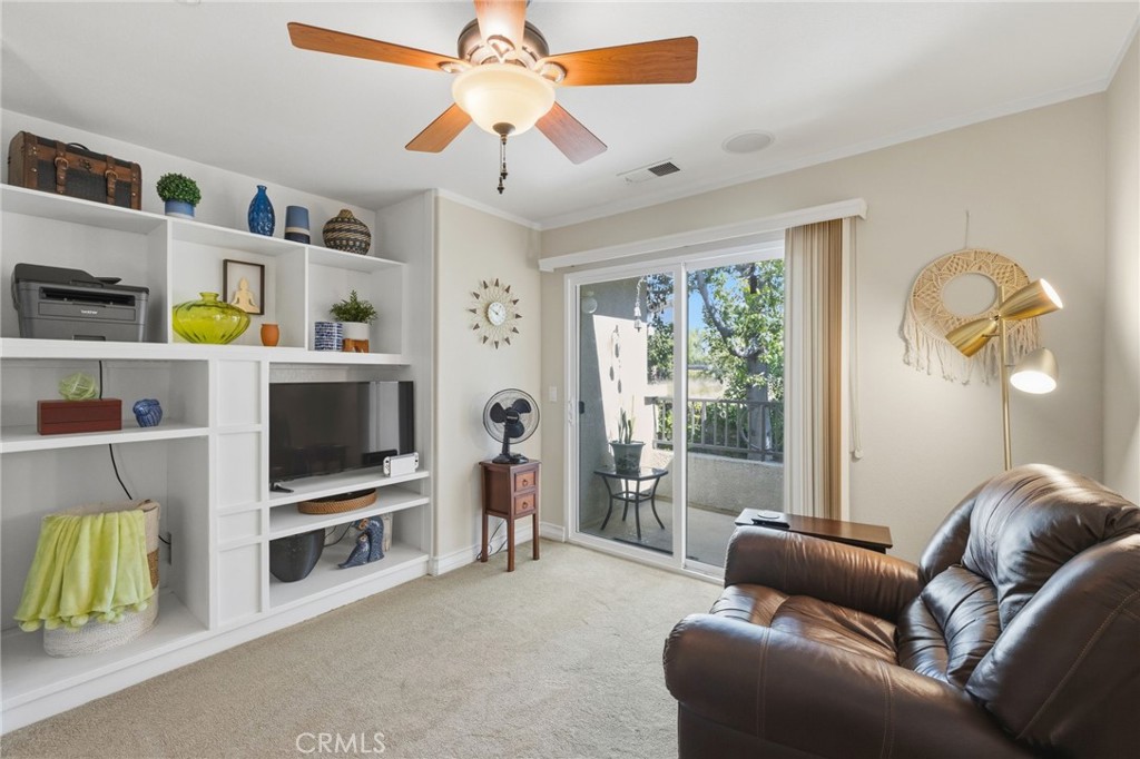 7331 Shelby Place, Unit 84 Rancho Cucamonga, CA 91739 - Photo 31 of 43 a living room with furniture and a flat screen tv