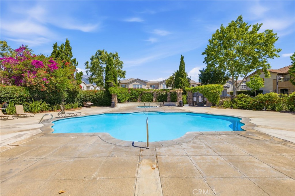 7331 Shelby Place, Unit 84 Rancho Cucamonga, CA 91739 - Photo 39 of 43 a view of a swimming pool with a lounge chairs