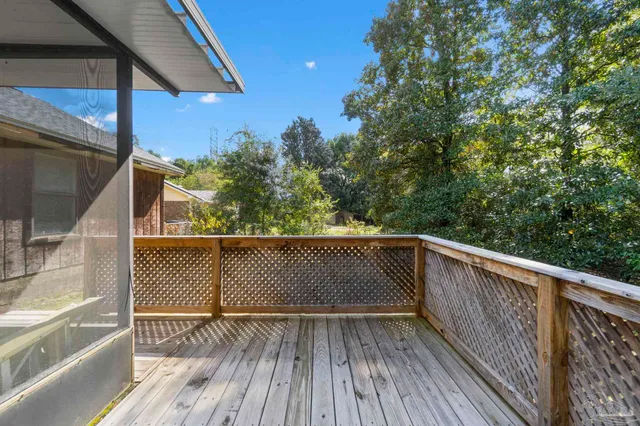 a view of balcony with wooden floor