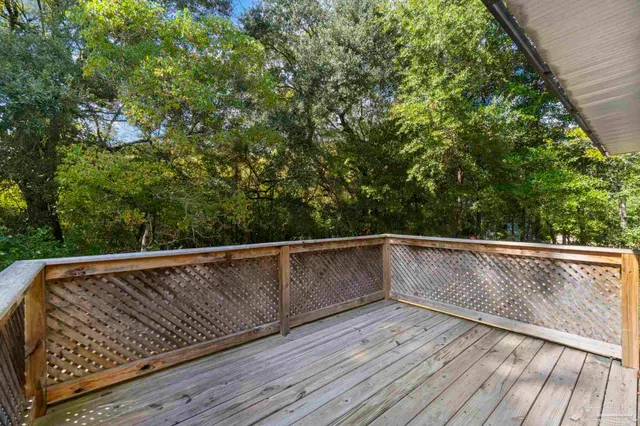 a view of balcony with wooden floor