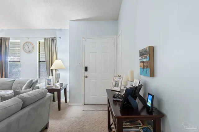 a living room with furniture and a lamp