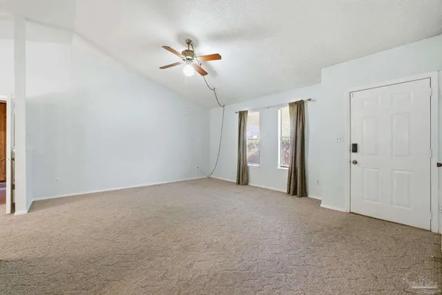 a view of an empty room with a window
