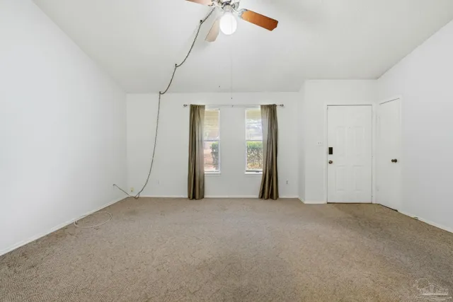 a view of an empty room with a window