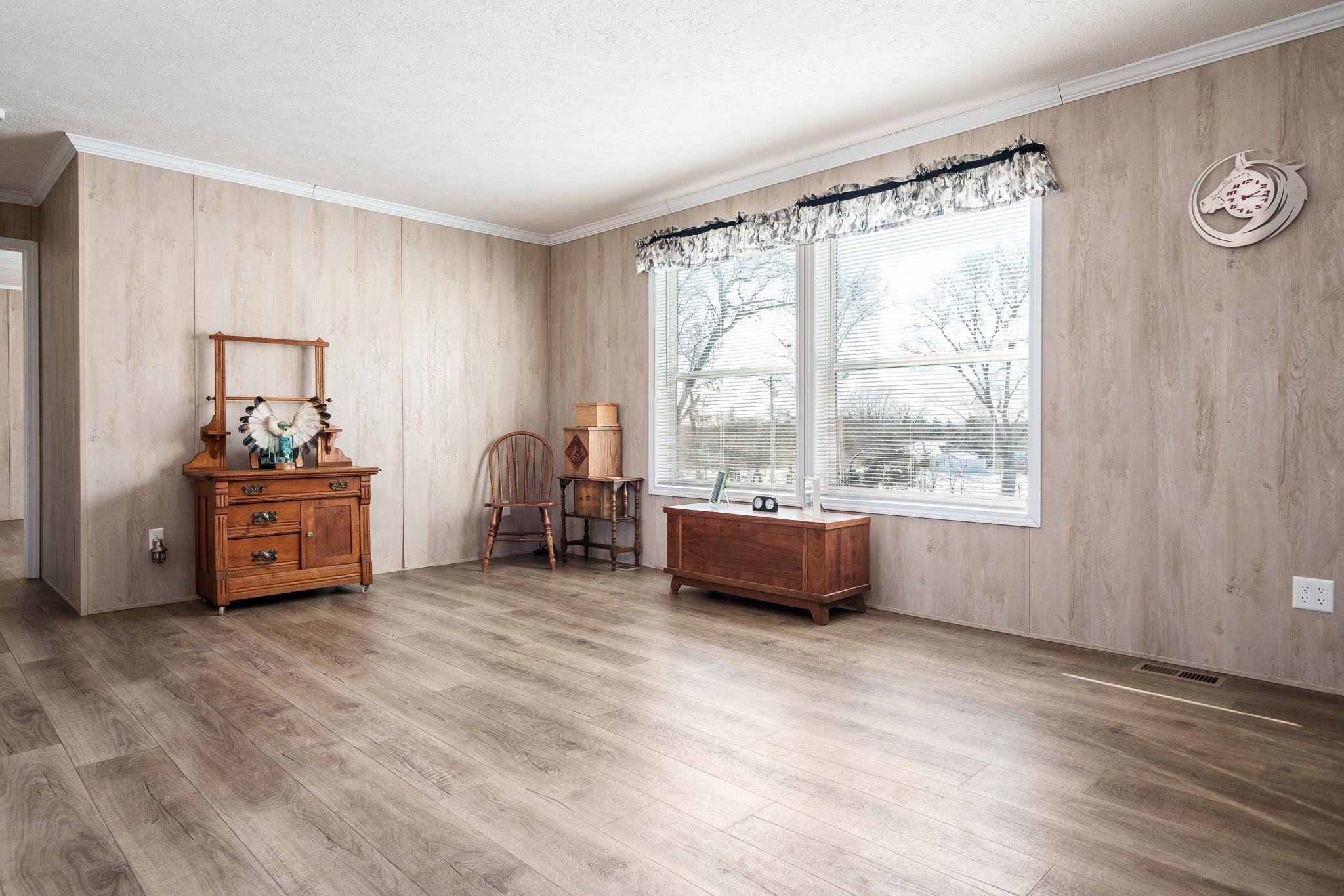 11447 South County Rd K Beloit, WI 53511 - Photo 14 of 51 a room with a bed and a large window