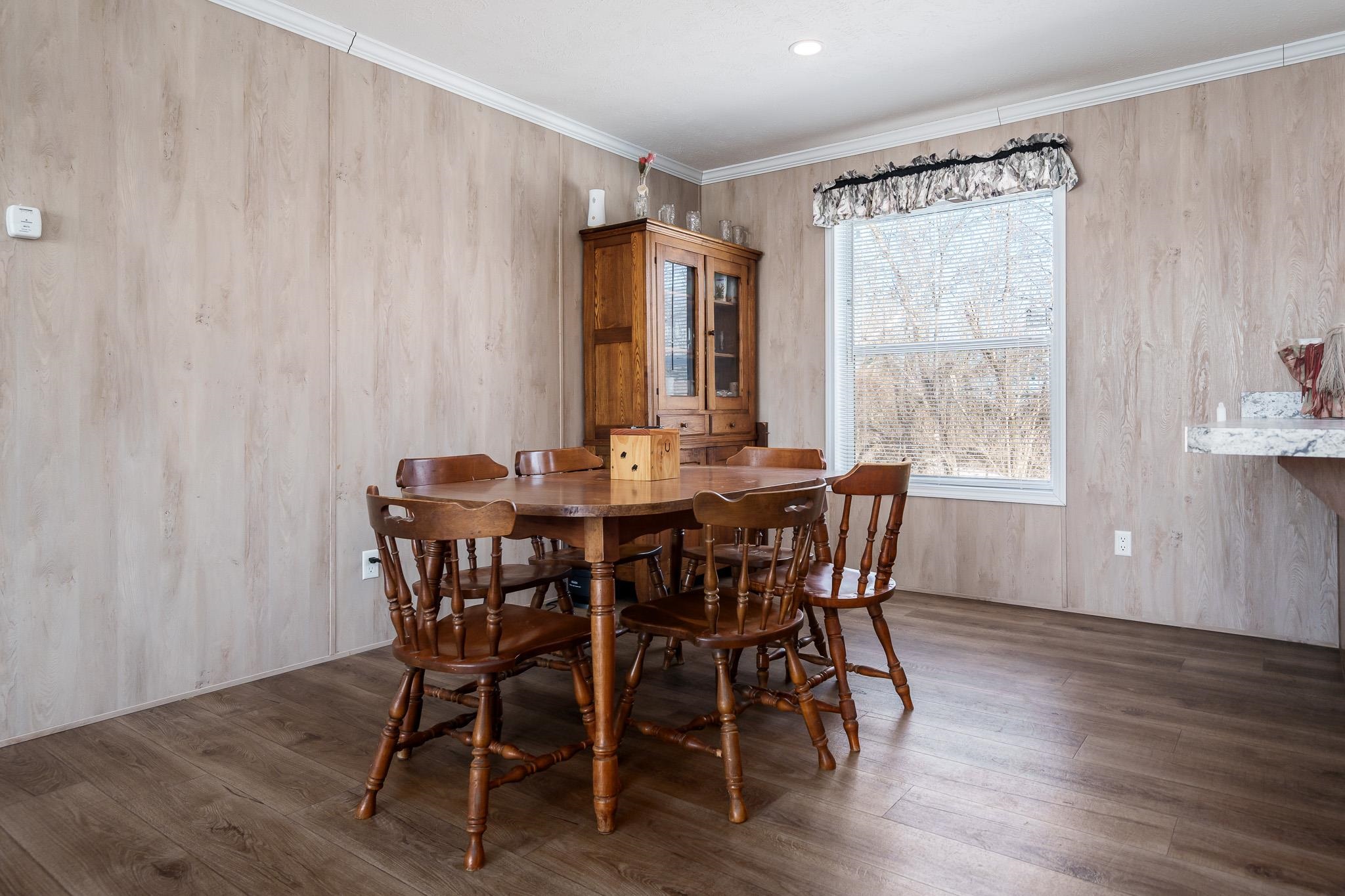 11447 South County Rd K Beloit, WI 53511 - Photo 18 of 51 a view of a dining room with furniture window and wooden floor