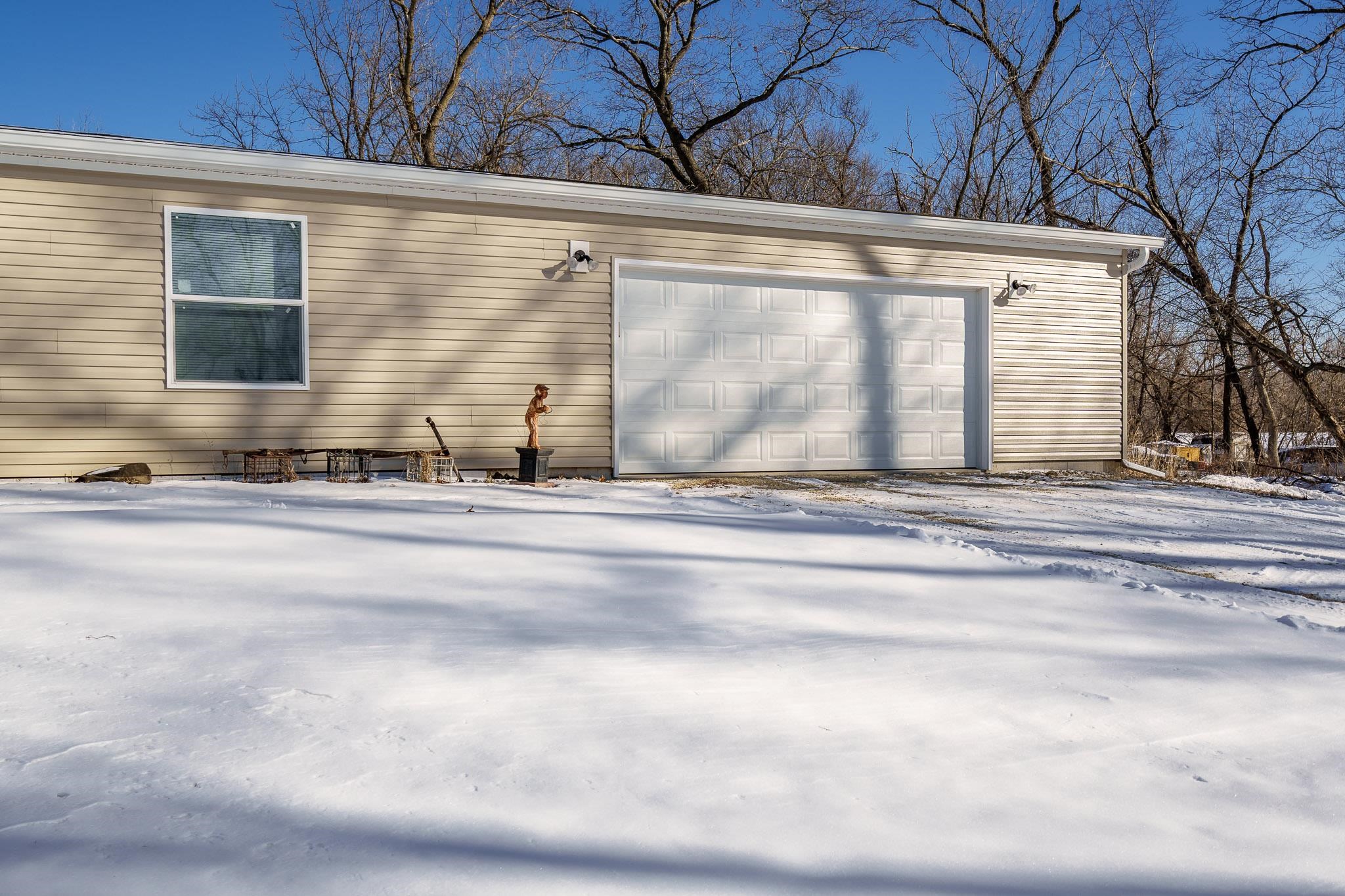 11447 South County Rd K Beloit, WI 53511 - Photo 4 of 51 a view of a house with a yard