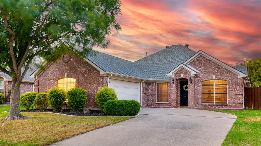 10814 Spring Lake Road Frisco, TX 75035 - Photo 1 of 1 a front view of a house with a garden and plants