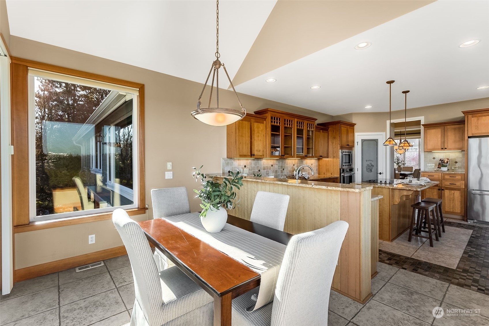 9306 Milburn Loop Southeast Olympia, WA 98513 - Photo 14 of 40 a view of a dining room with furniture window and outside view