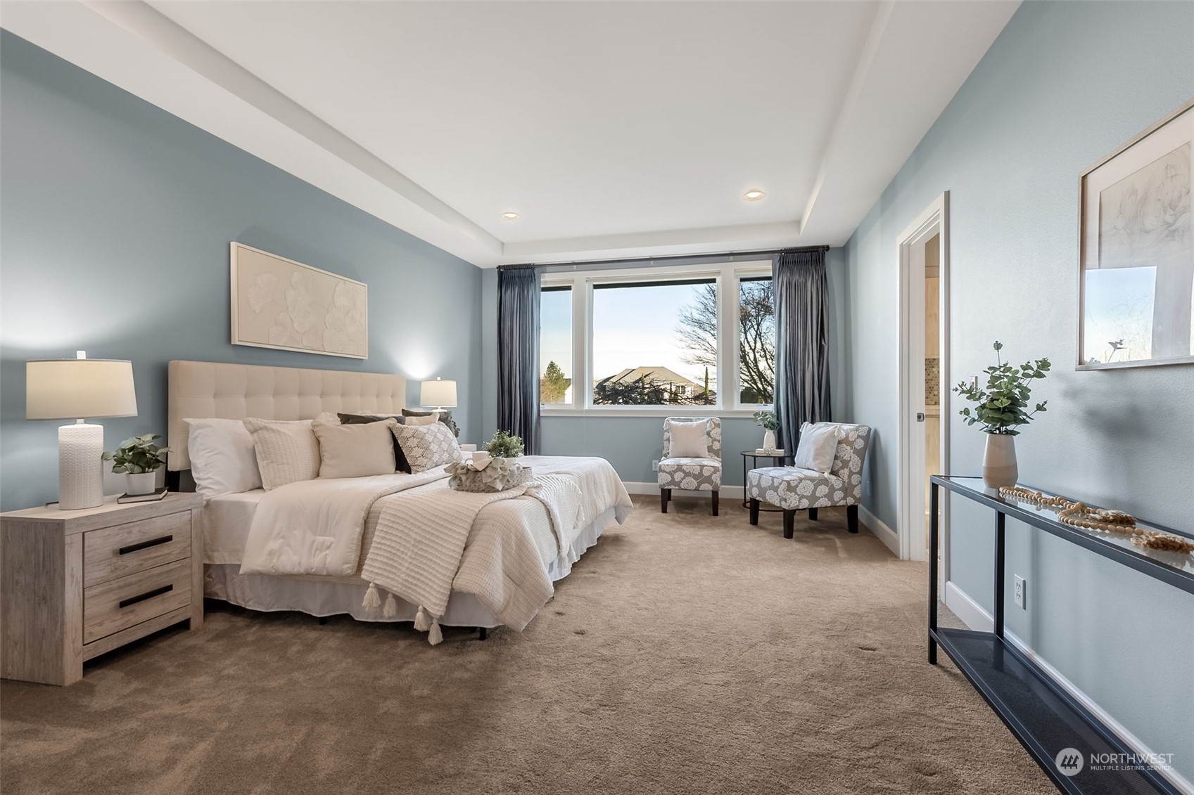 9306 Milburn Loop Southeast Olympia, WA 98513 - Photo 17 of 40 a spacious bedroom with a bed and a couch